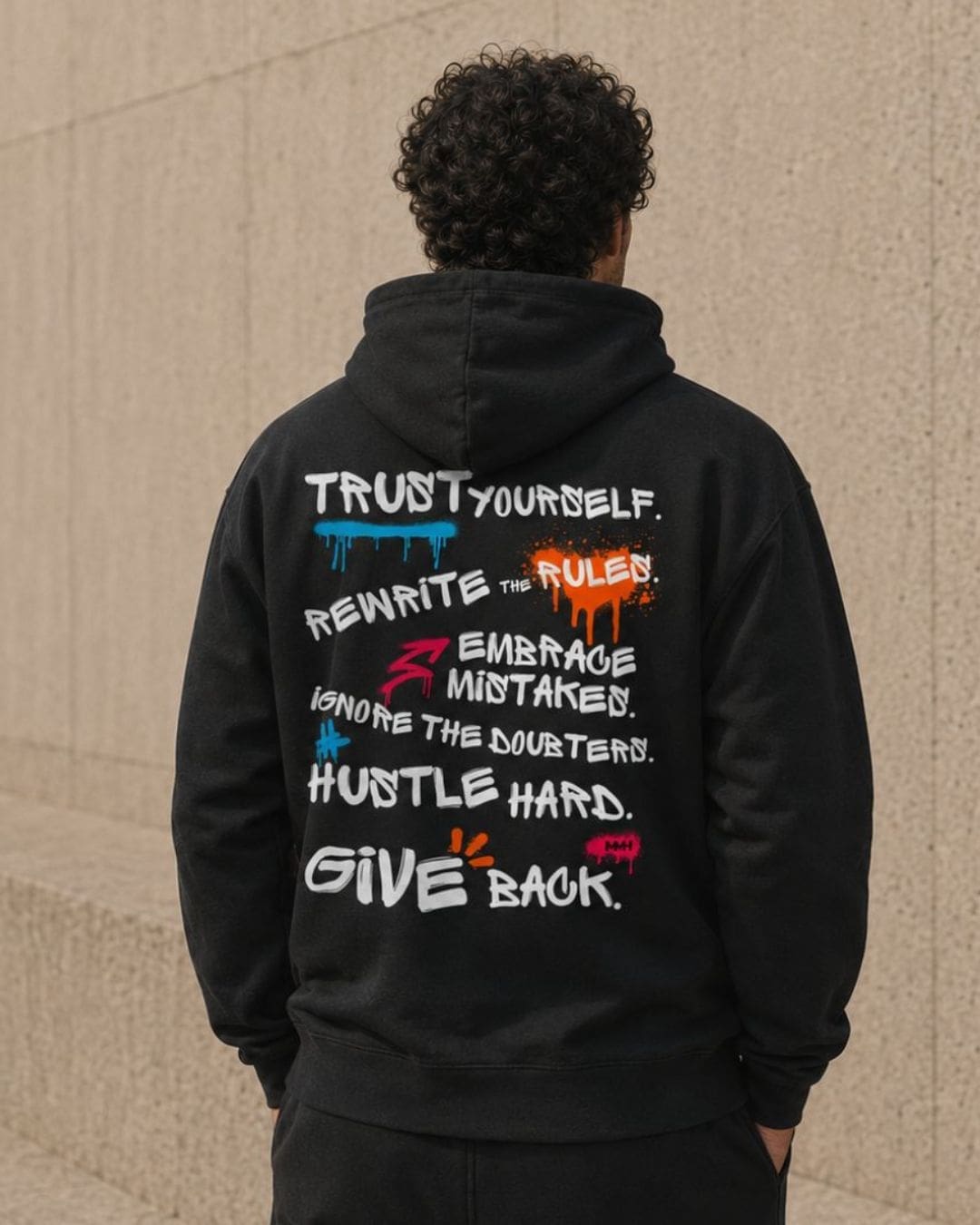 Black hoodie with motivational graffiti-style slogans